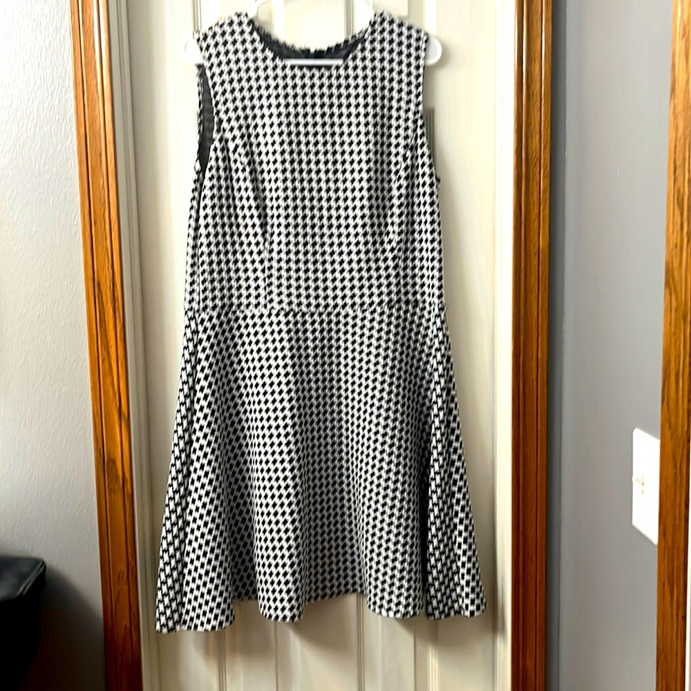 Black and white houndstooth fit and flare sleeveless dress